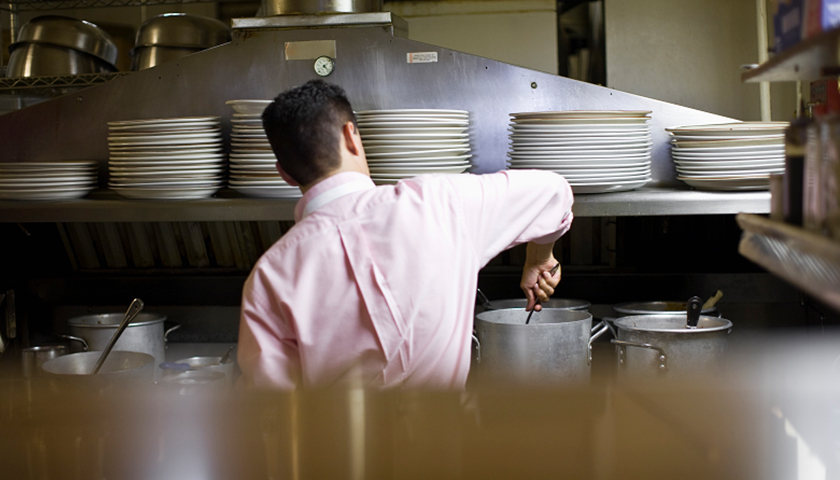 Worker in restaurant kitchen