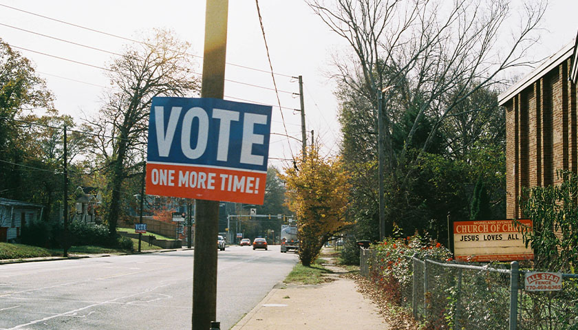"VOTE ONE MORE TIME" sign on an electric pole in Atlanta, Georgia
