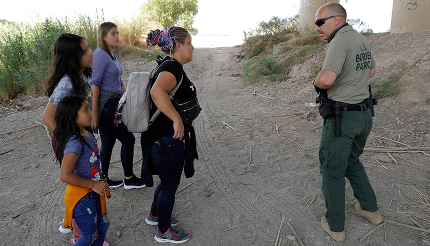 U.S. Border Patrol agents perform a water rescue and assist a migrant family in distress near Eagle Pass, Texas, August 20, 2019, CBP photo by Jaime Rodriguez Sr.